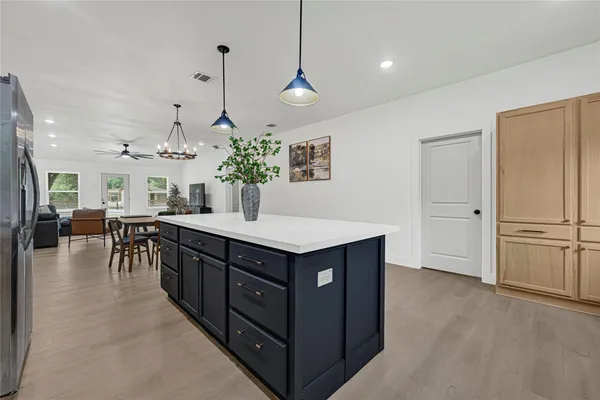 a kitchen with stainless steel appliances granite countertop a stove and a refrigerator
