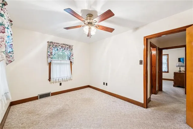 wooden floor in an empty room and a window