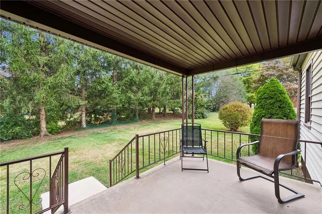 a view of a two chairs in the deck