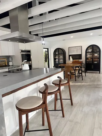 a view of dining room with furniture and wooden floor