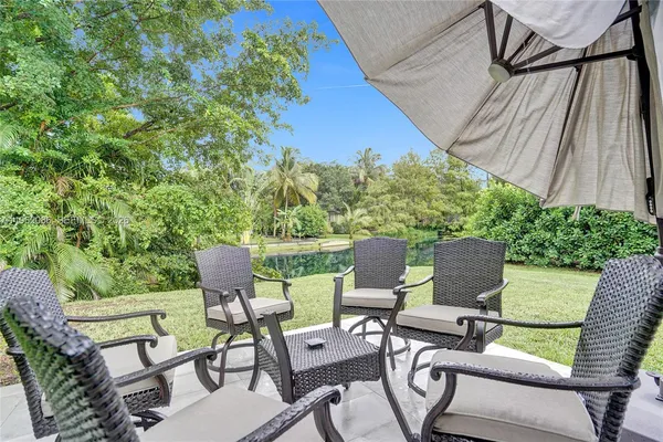 a view of a yard with a tree