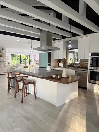 a living room with furniture and potted plant