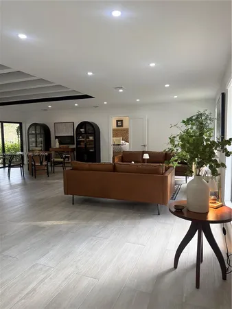 a bedroom with a bed and a flat tv screen on the dresser