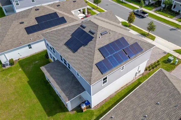 an aerial view of a swimming pool with outdoor space