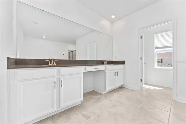 a close view of two sink and a mirror