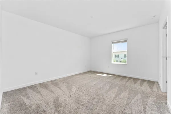 a white toilet sitting next to a bath tub