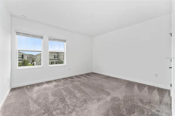 a utility room with cabinets washer and dryer