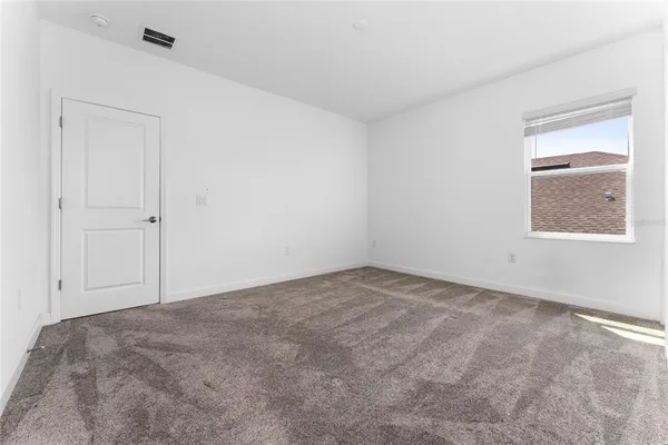 a view of a house with a big yard