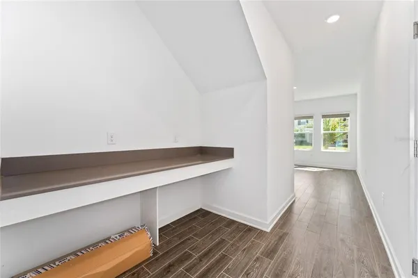 a view of a house with pool and sitting area