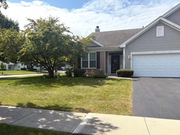 a view of a house with swimming pool and a yard