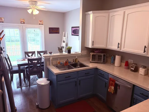 a kitchen with a sink and cabinets