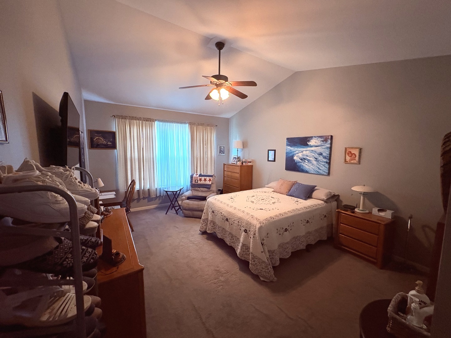 1461 Waterside Drive DeKalb, IL 60115 - Photo 17 of 29 a bedroom with a bed window and a flat screen tv