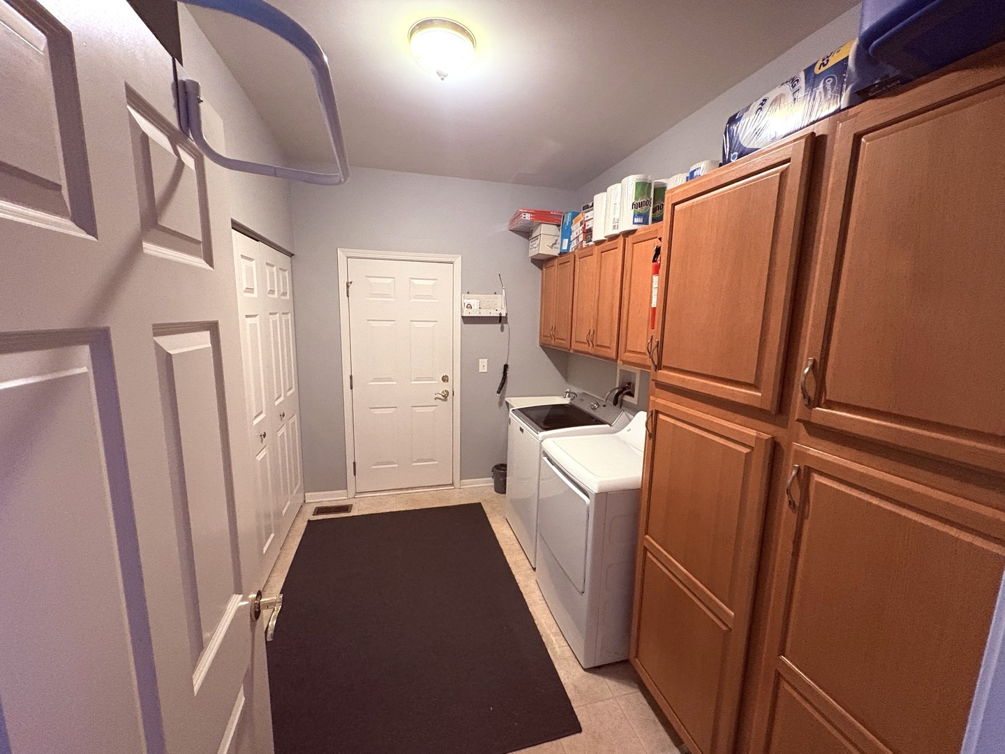 1461 Waterside Drive DeKalb, IL 60115 - Photo 24 of 29 a view of walk in closet with clothes and shoes