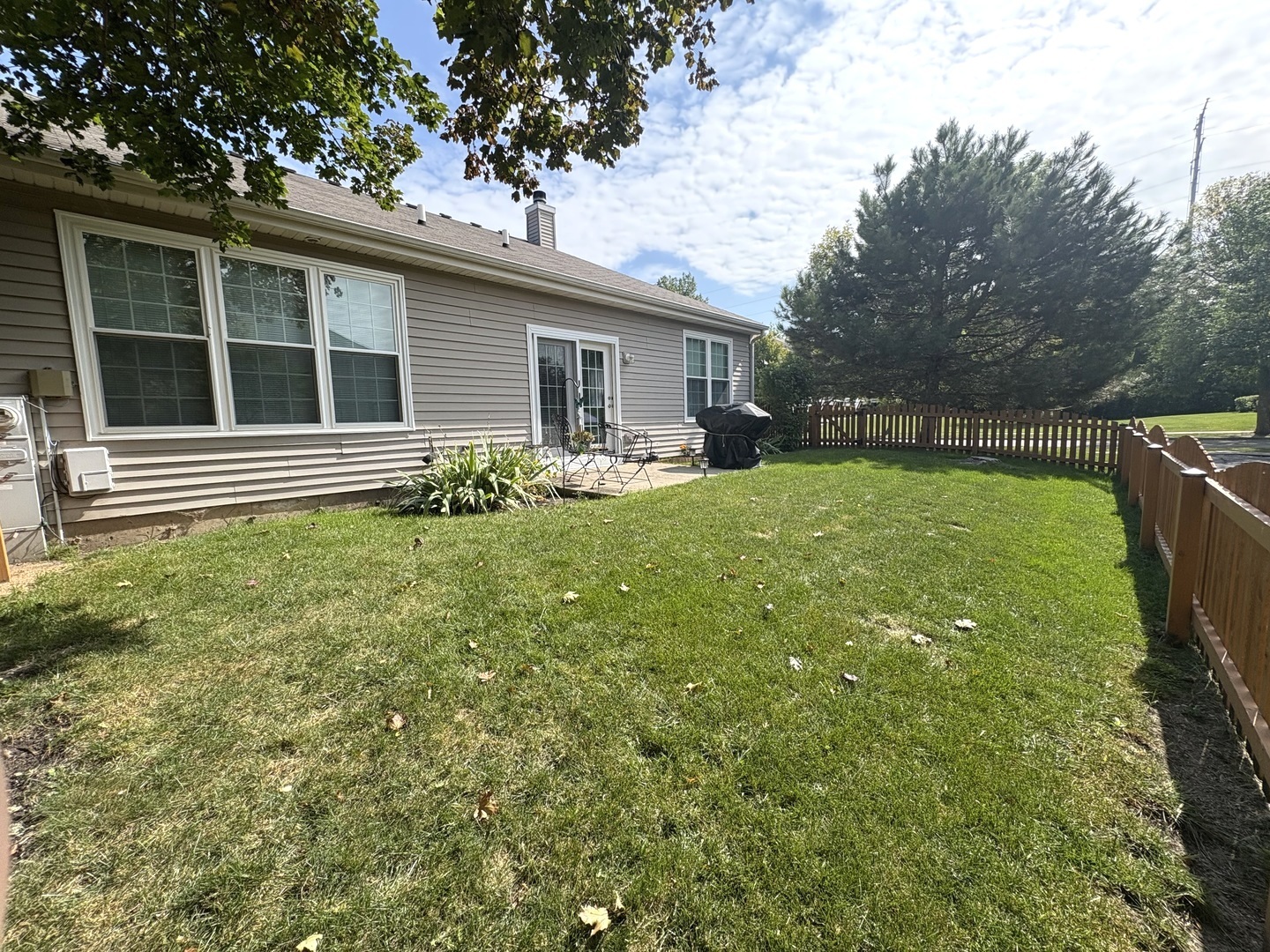 1461 Waterside Drive DeKalb, IL 60115 - Photo 27 of 29 a house view with swimming pool in front of it