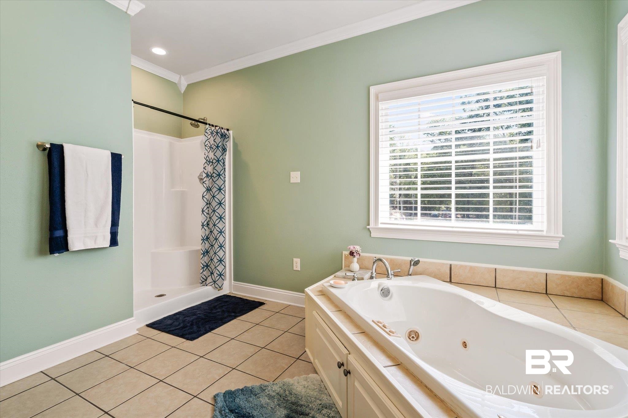 72 Limestone Drive Jackson, AL 36545 - Photo 21 of 38 Bathroom featuring crown molding, tile patterned flooring, and shower with separate bathtub
