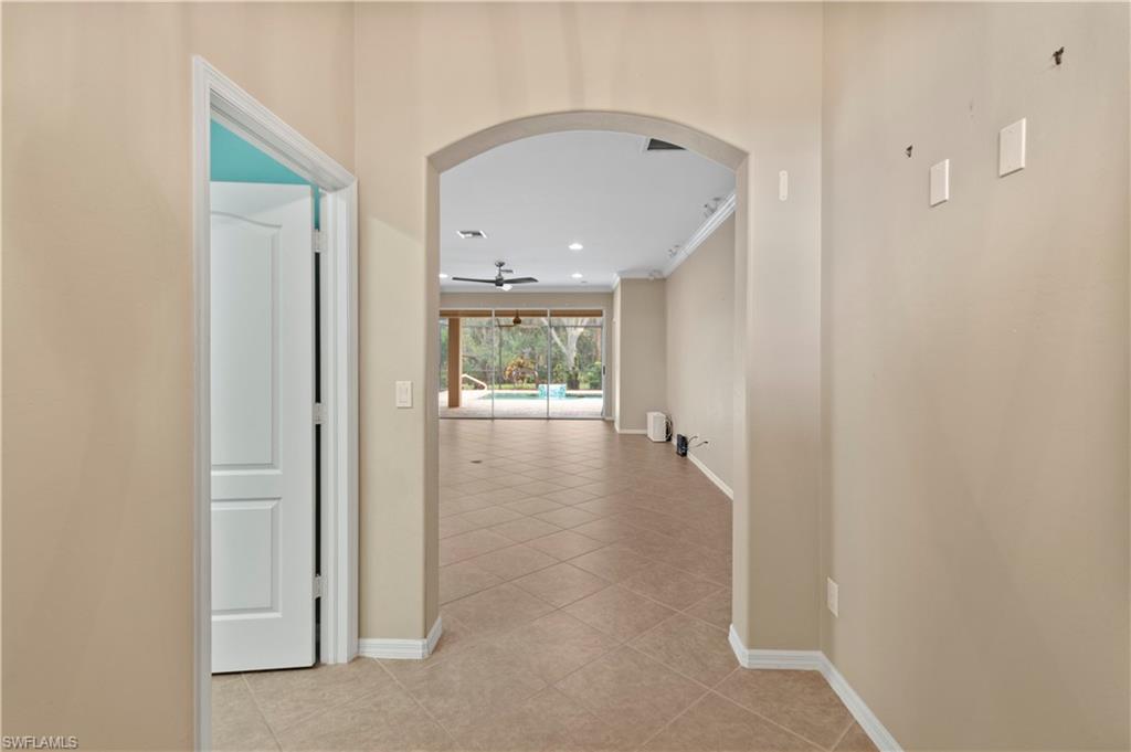 20451 Rookery Drive Estero, FL 33928 - Photo 18 of 44 a view of an empty room and glass door
