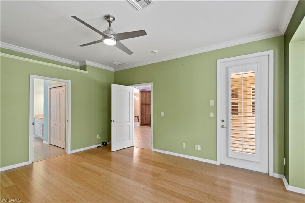 20451 Rookery Drive Estero, FL 33928 - Photo 20 of 44 wooden floor in an empty room with a window
