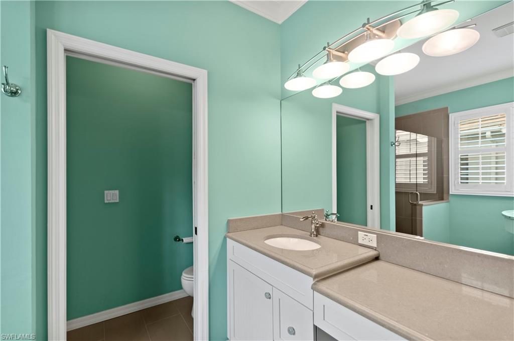 20451 Rookery Drive Estero, FL 33928 - Photo 25 of 44 a bathroom with a sink and a mirror