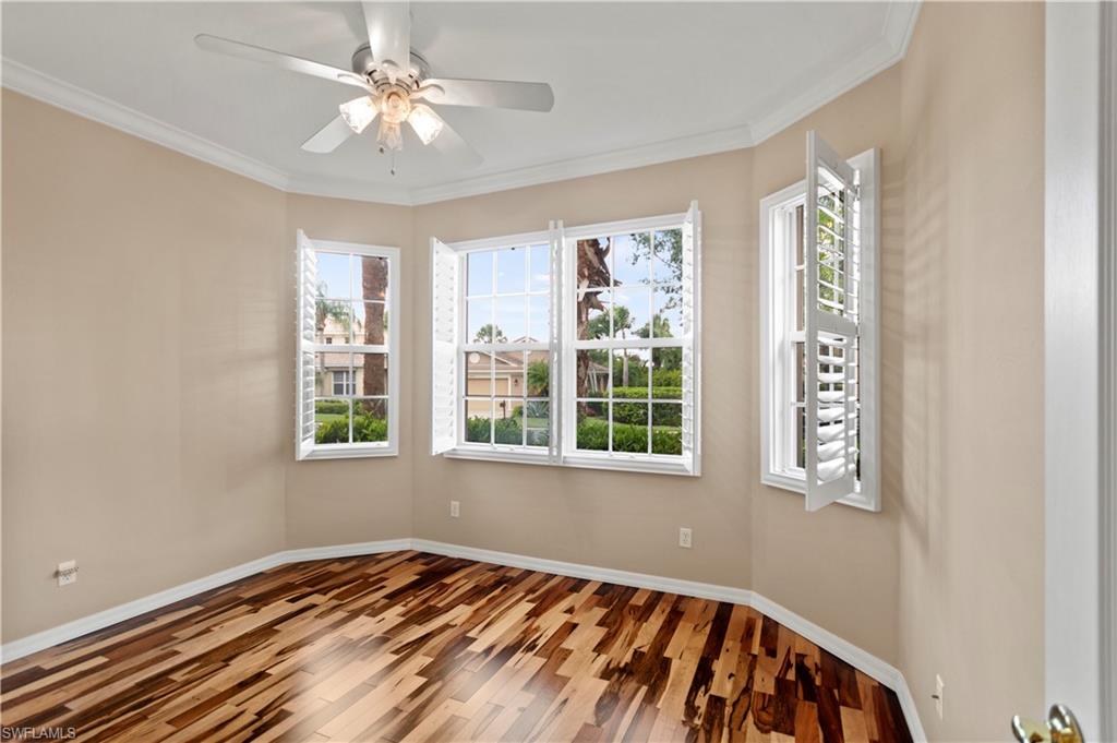 20451 Rookery Drive Estero, FL 33928 - Photo 26 of 44 a view of an empty room with window and a chandelier fan