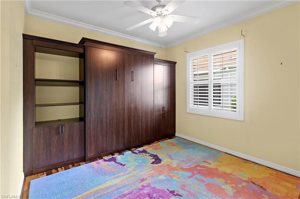 20451 Rookery Drive Estero, FL 33928 - Photo 29 of 44 a bedroom with a bed and a window