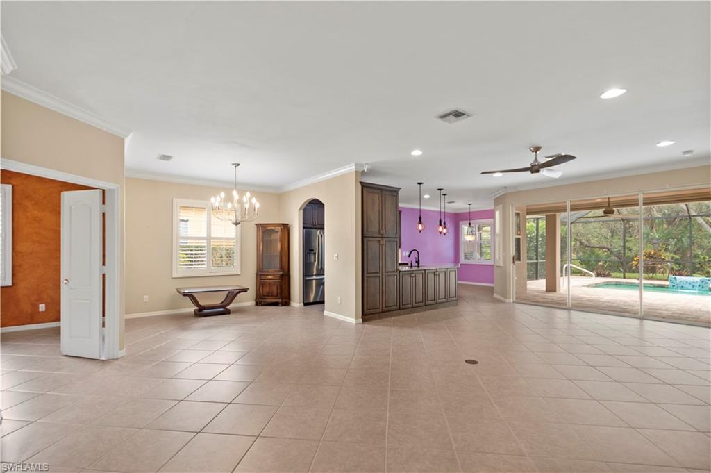 20451 Rookery Drive Estero, FL 33928 - Photo 9 of 44 a view of a livingroom with a flat screen tv and outdoor space