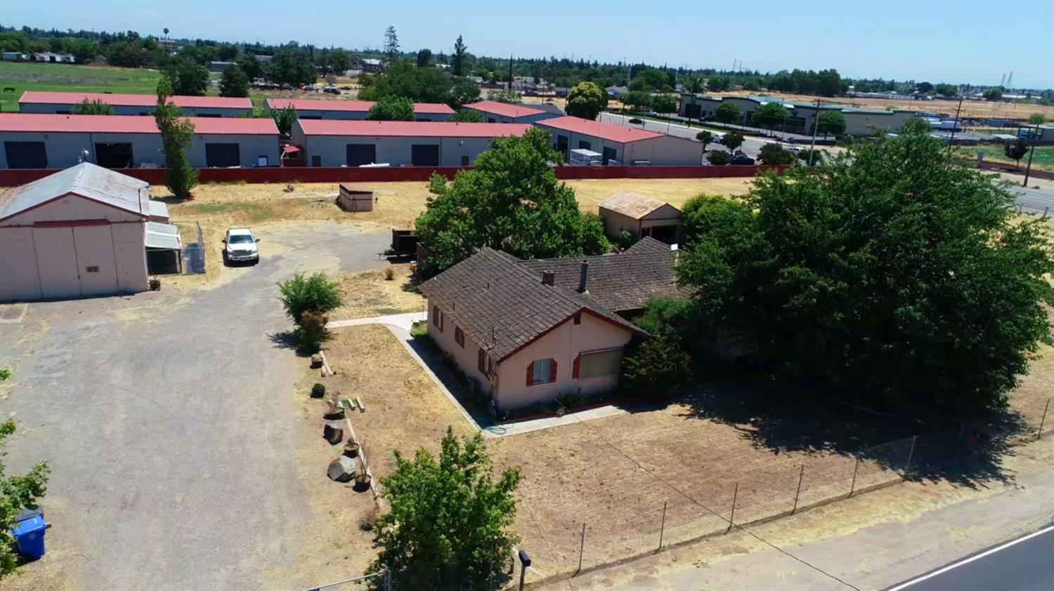 140 Swanson Road Manteca, CA 95337 - Photo 9 of 14 an aerial view of a house with a garden and lake view