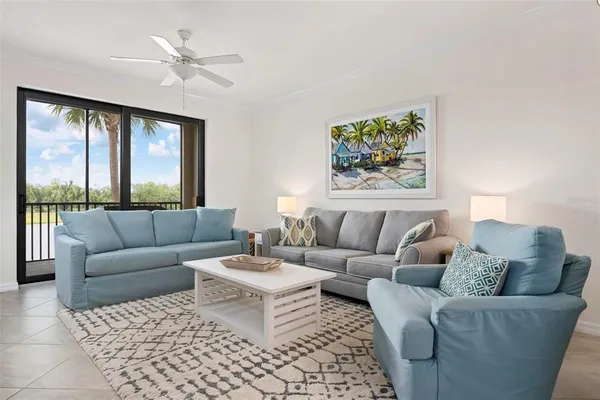 a living room with furniture and a large window