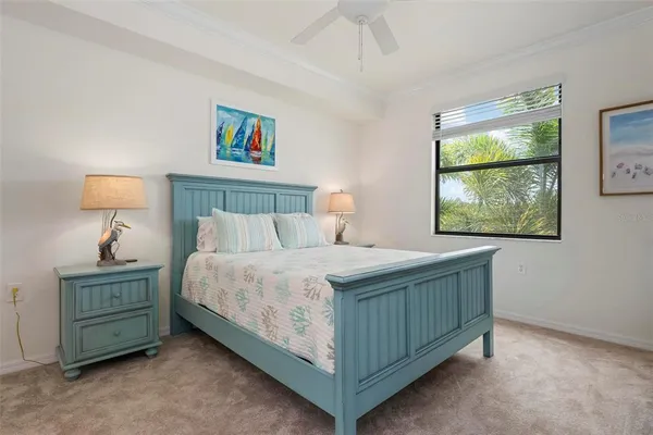 a bedroom with a bed and a night stand