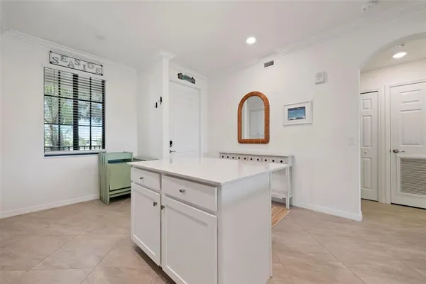 a utility room with cabinets washer and dryer