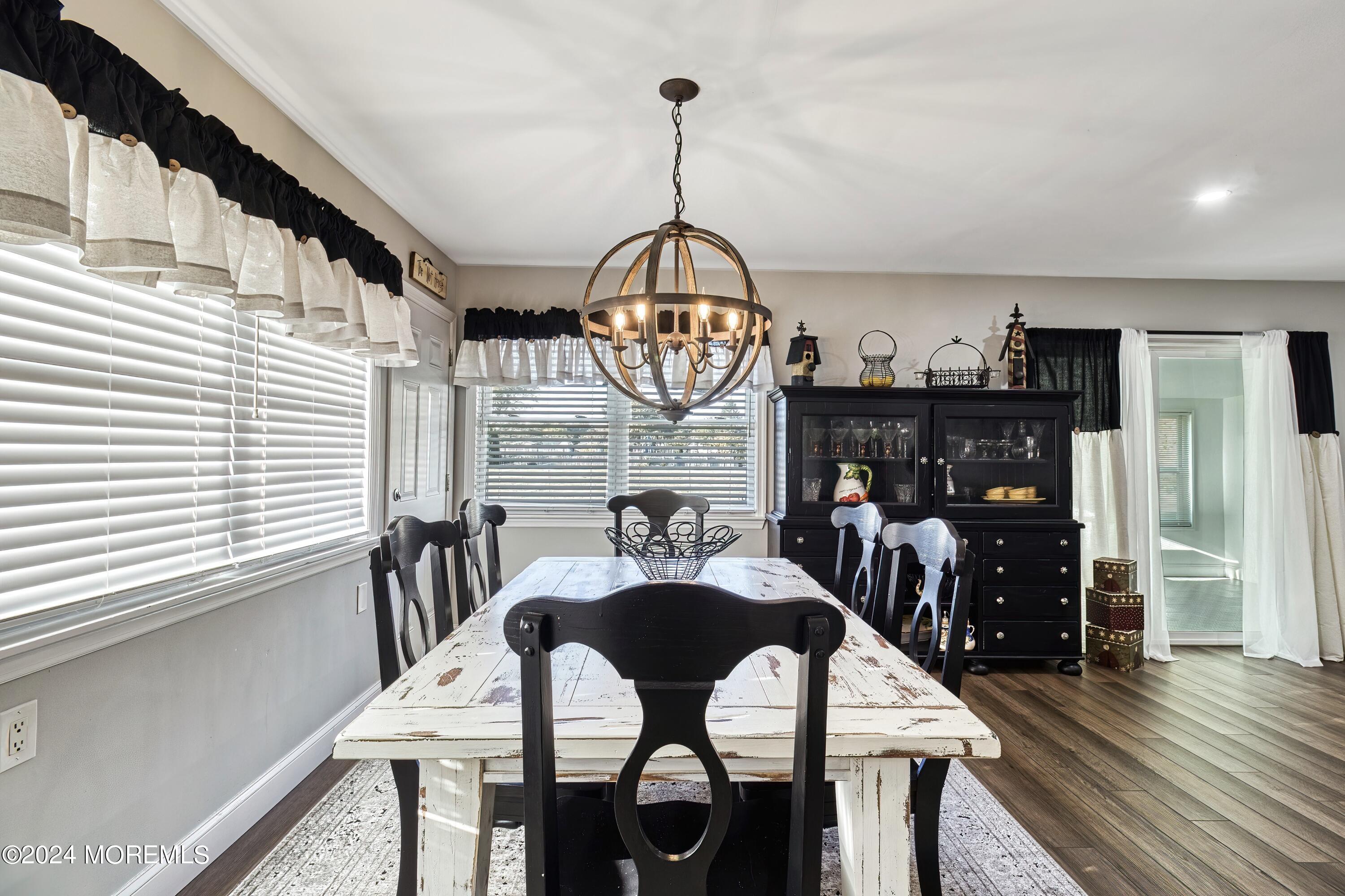 6 Masters Road Brick, NJ 08724 - Photo 11 of 38 a view of a dining room with furniture window and wooden floor