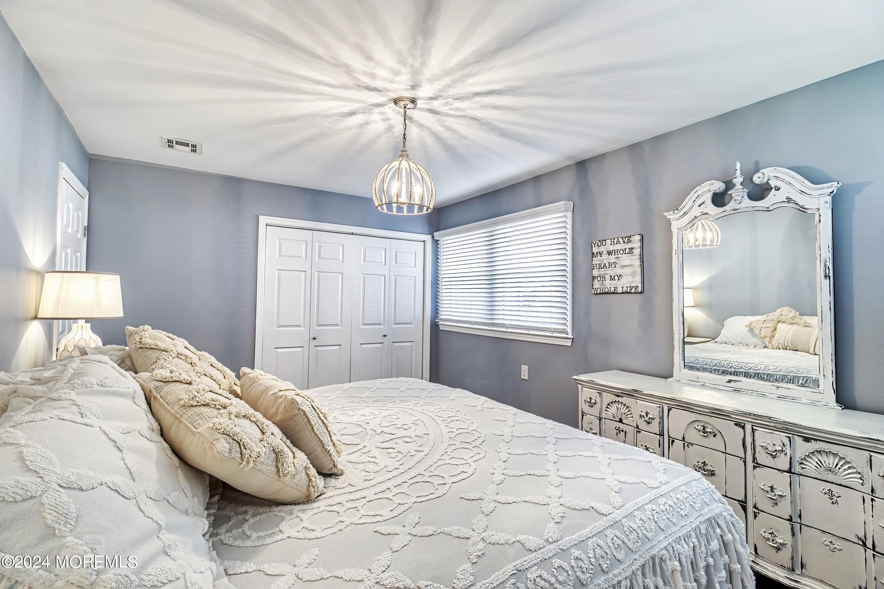 6 Masters Road Brick, NJ 08724 - Photo 16 of 38 a bedroom with a large bed and a window