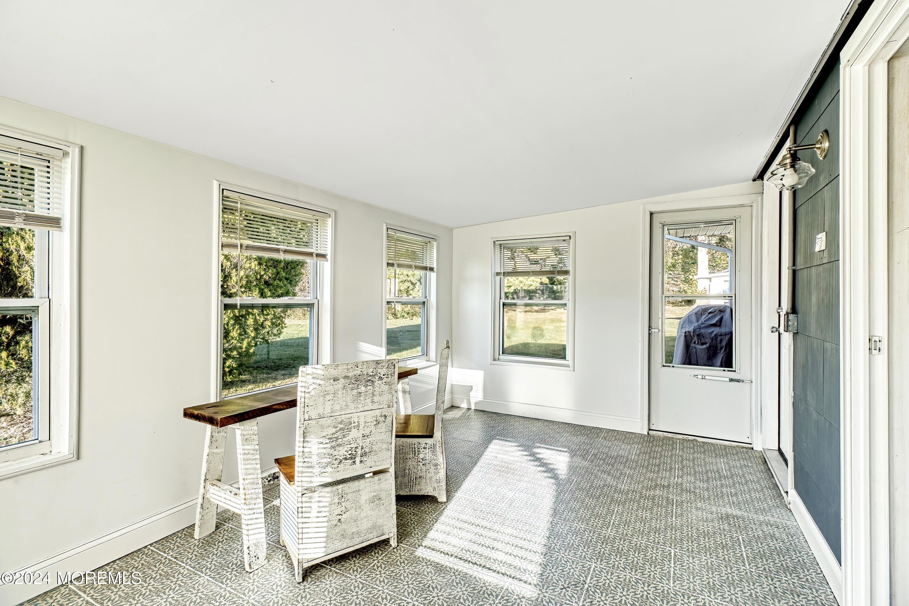6 Masters Road Brick, NJ 08724 - Photo 28 of 38 a living room with furniture and windows