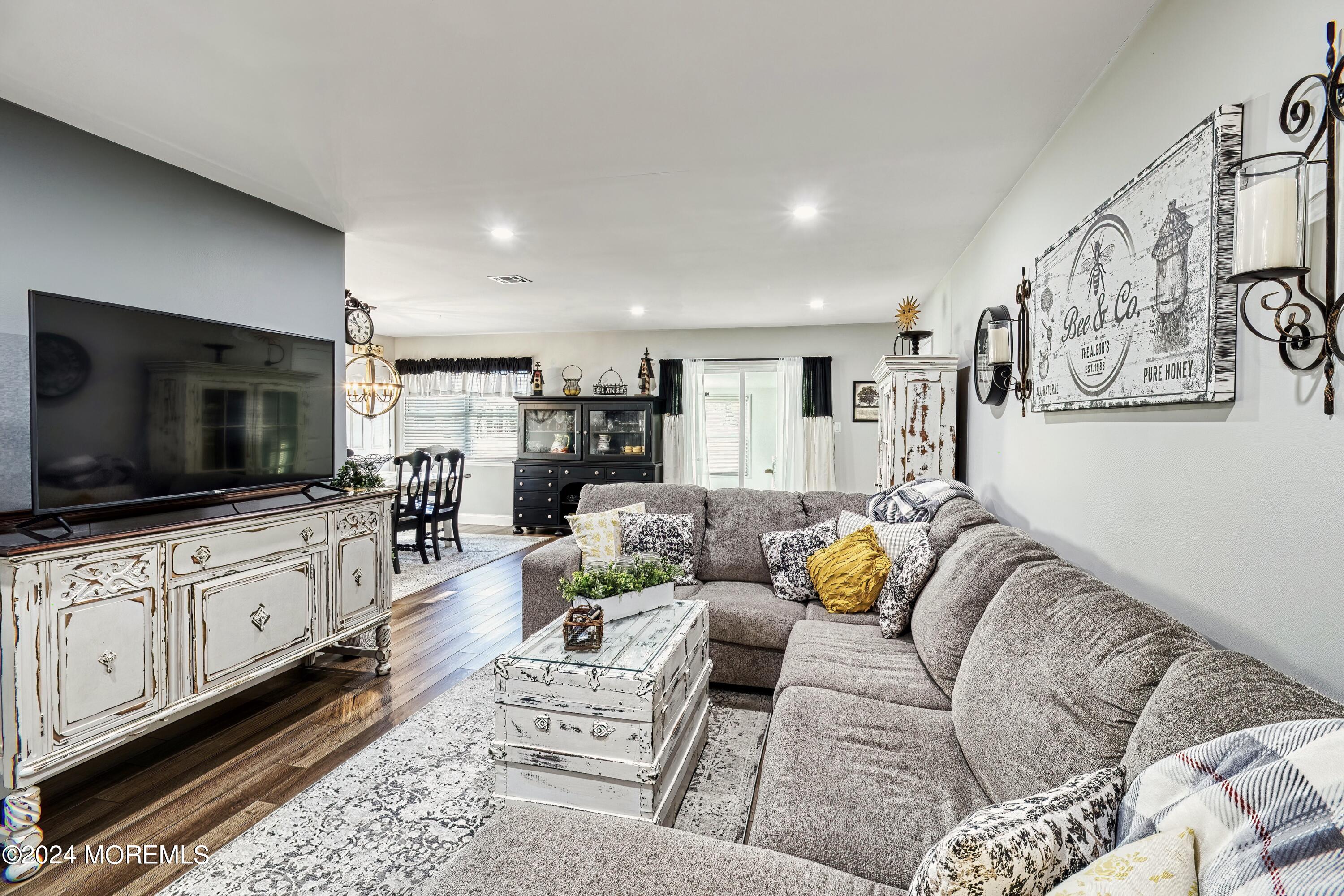 6 Masters Road Brick, NJ 08724 - Photo 4 of 38 a living room with furniture and a flat screen tv