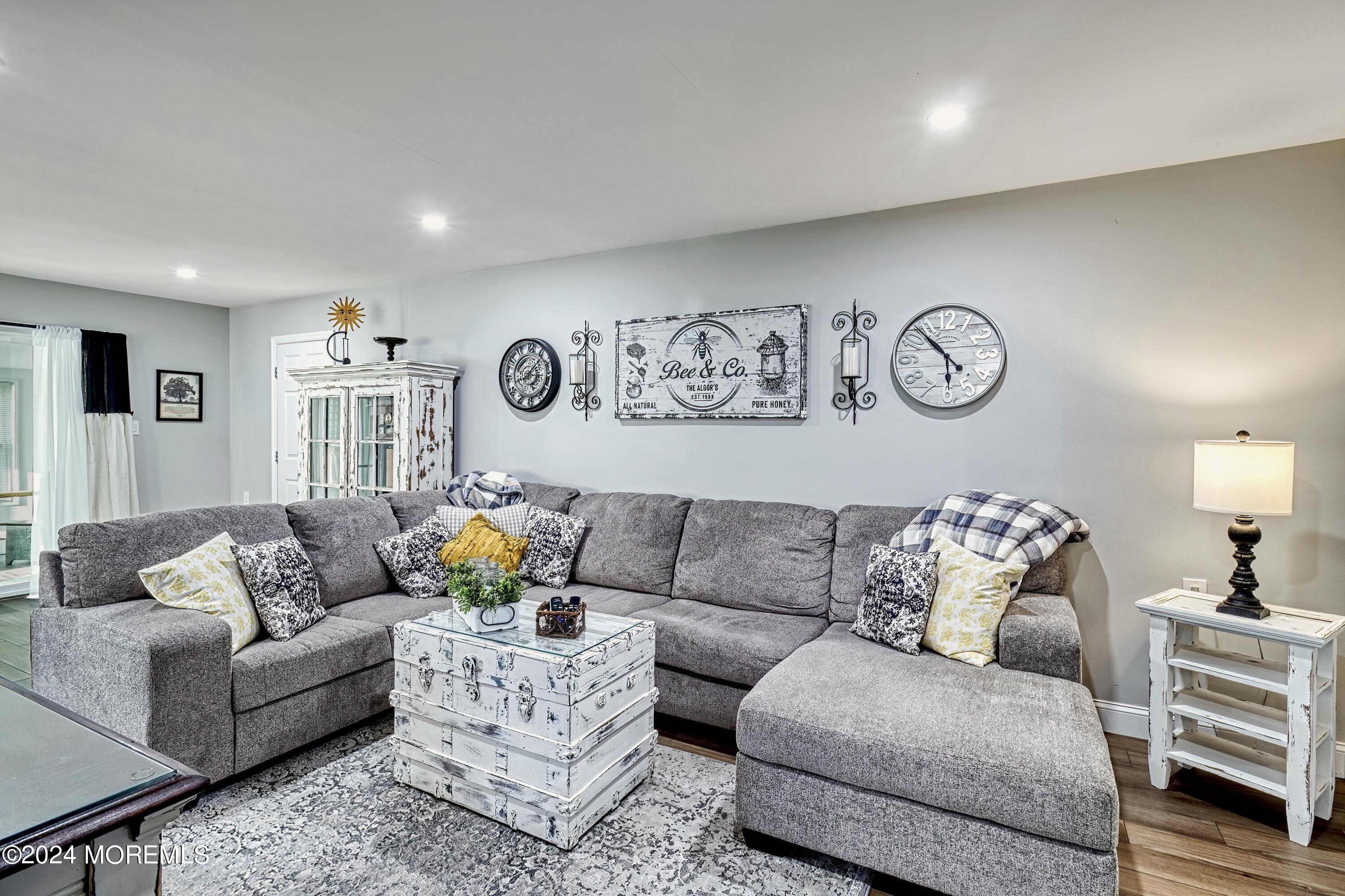 6 Masters Road Brick, NJ 08724 - Photo 5 of 38 a living room with furniture and wooden floor