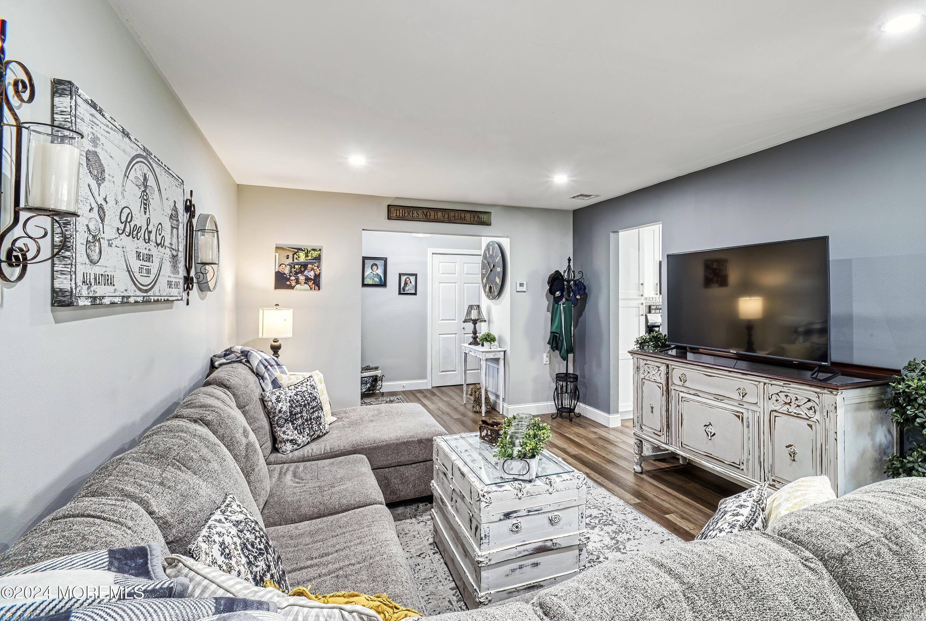6 Masters Road Brick, NJ 08724 - Photo 7 of 38 a living room with furniture and a flat screen tv