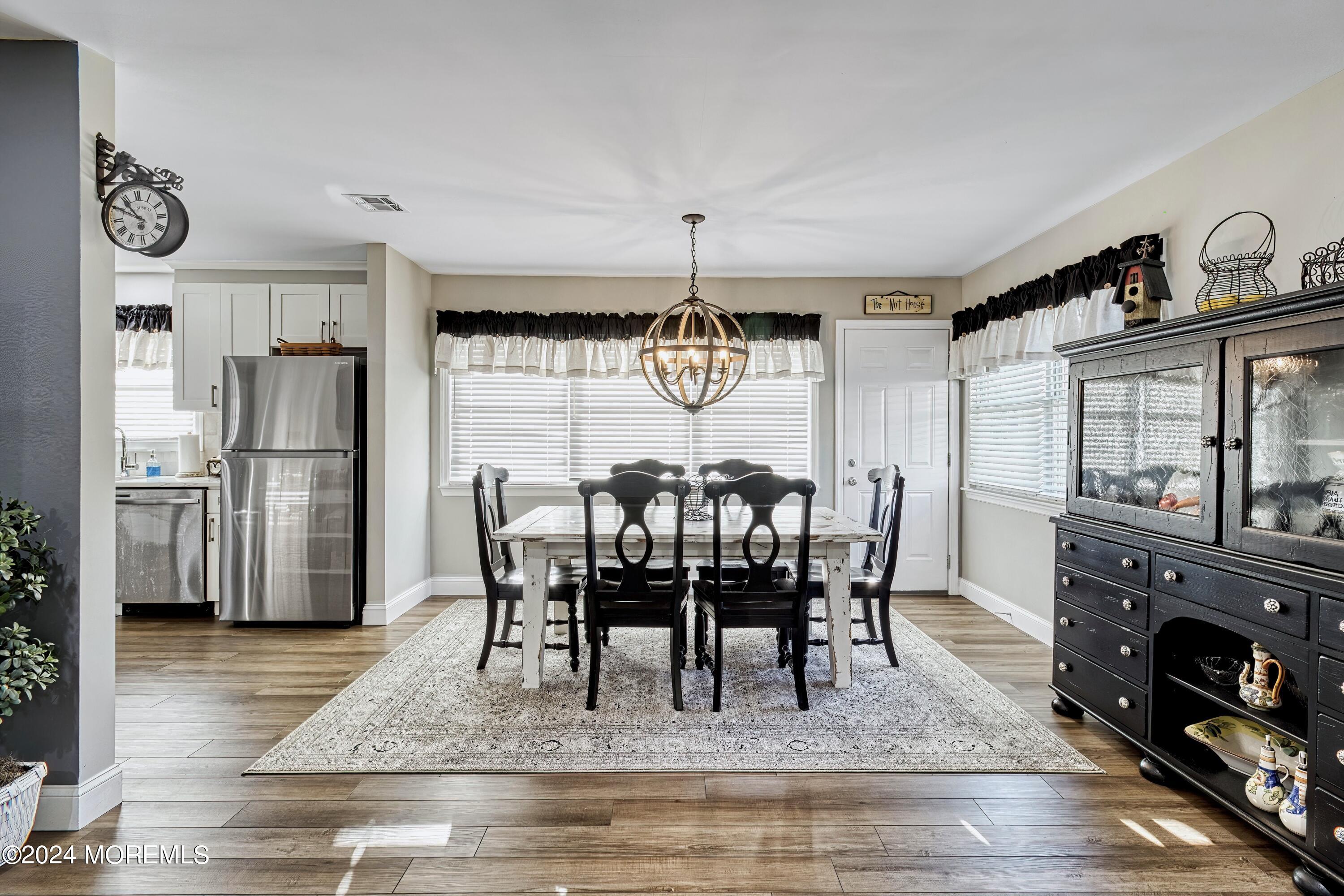 6 Masters Road Brick, NJ 08724 - Photo 8 of 38 a view of a dining room with furniture window and wooden floor
