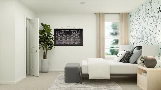 a bedroom with a bed and a potted plant