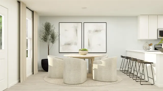 a white vase sitting on top of a table