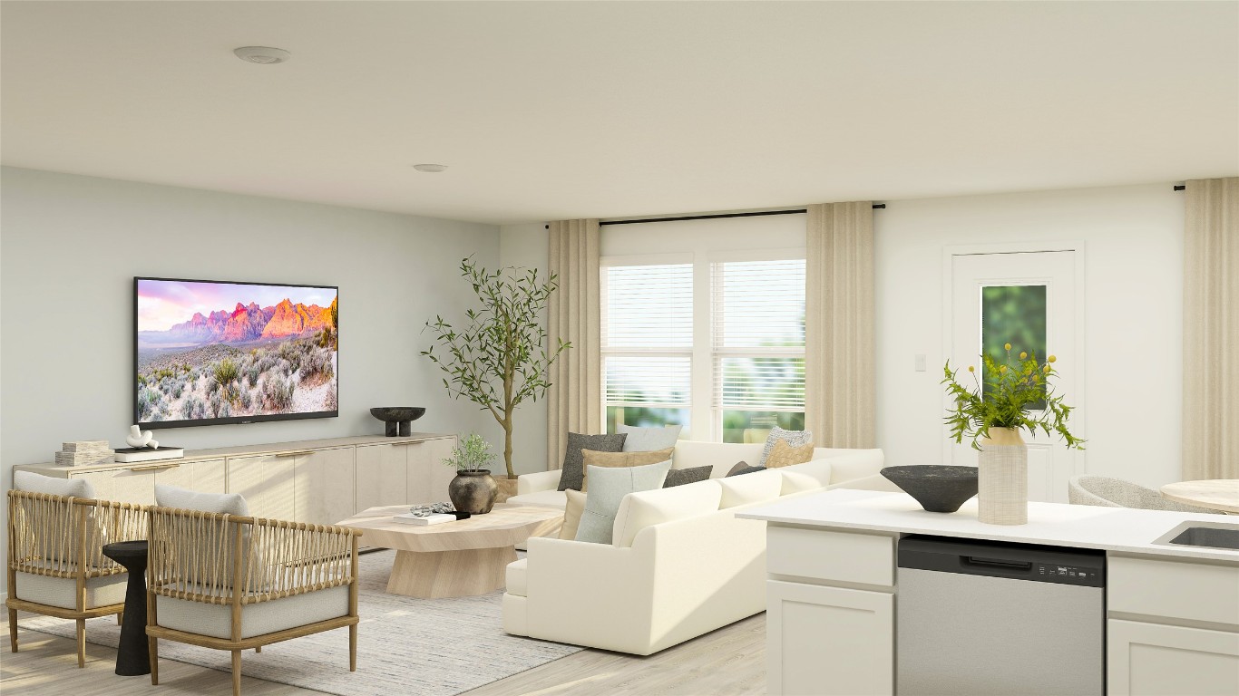 225 Stumpy Street San Marcos, TX 78666 - Photo 23 of 38 a living room with furniture a large window and a flat screen tv