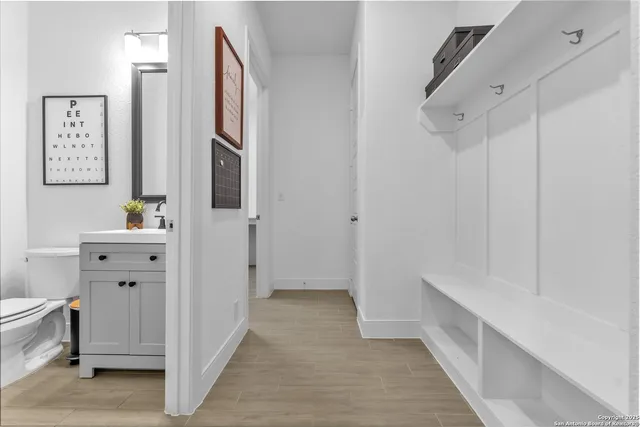 a view of a hallway with a livingroom