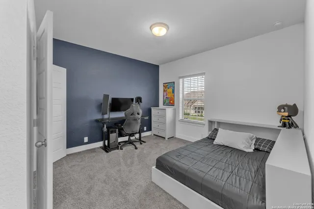 a room with gym equipment and a flat screen tv