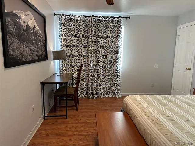 a bedroom with a bed and a table in it