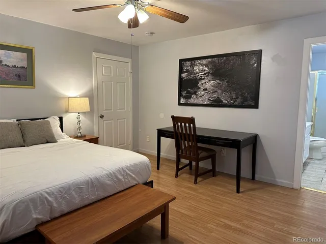 a bedroom with a bed and a table