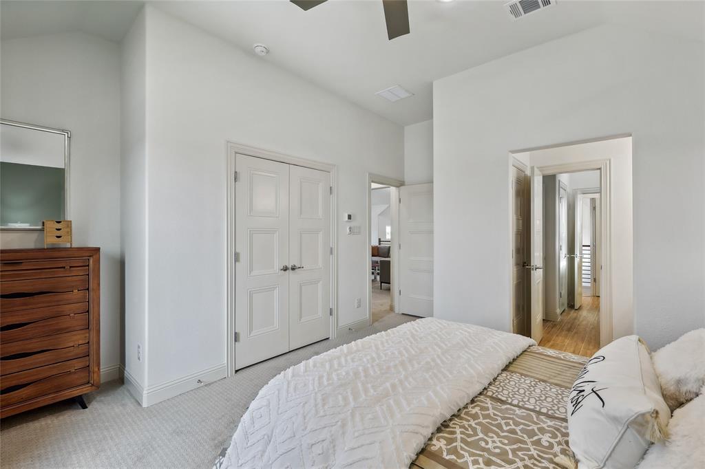 1604 Casting Ridge Mesquite, TX 75181 - Photo 33 of 38 Bedroom featuring vaulted ceilings, light neutral wall paint, and a double-door entryway