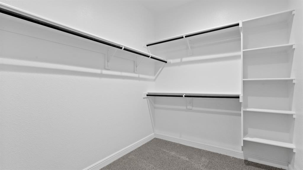 11305 Treehouse Trail Justin, TX 76247 - Photo 15 of 39 a view of an empty walk in closet