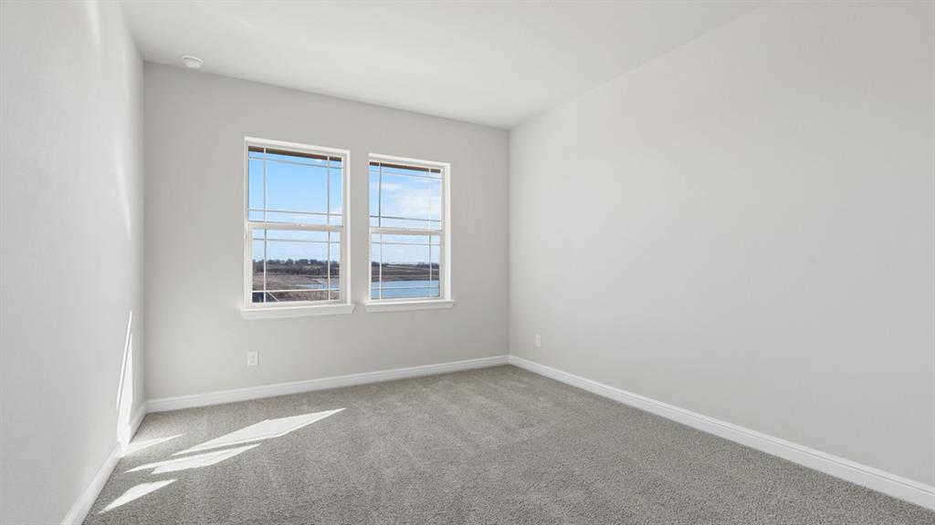 11305 Treehouse Trail Justin, TX 76247 - Photo 32 of 39 a view of an empty room with a window
