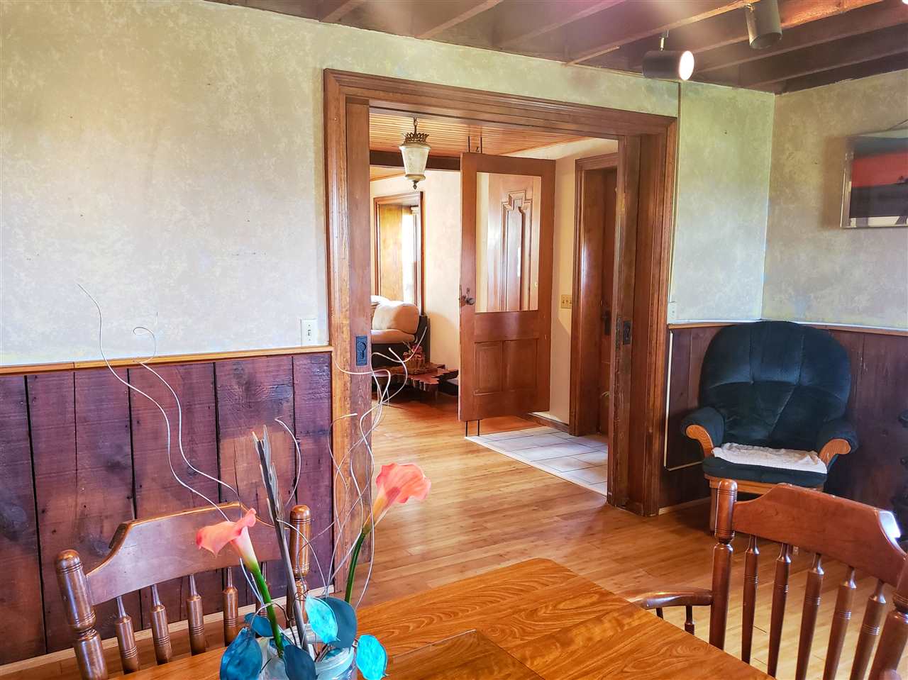 4365 East Brick Road Oregon, IL 61061 - Photo 6 of 25 a living room with furniture a flat screen tv and a large window