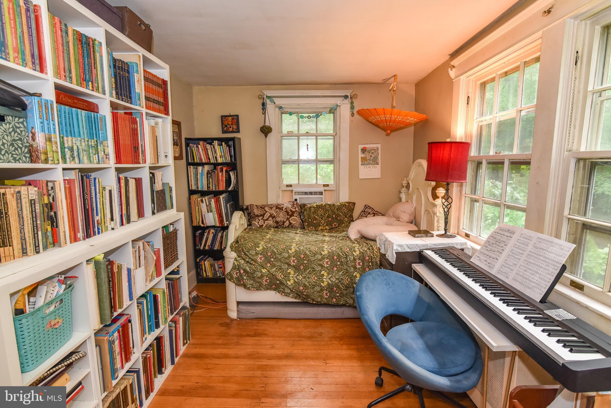 24 Merrymount Road Baltimore, MD 21210 - Photo 32 of 48 a living room with furniture a bookshelf and a window