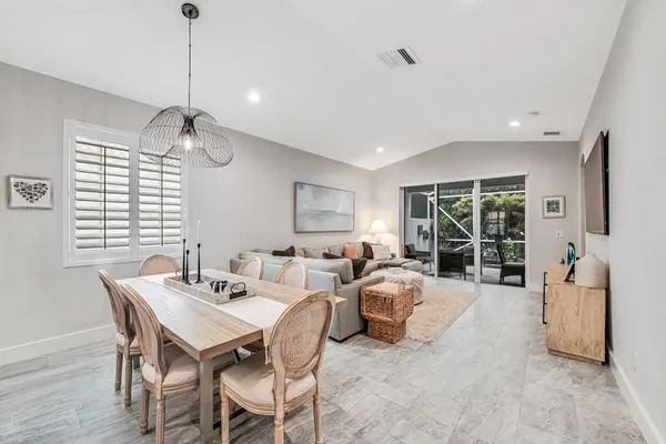a view of a dining room with furniture window and outside view