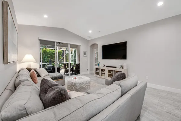 a living room with furniture and a flat screen tv